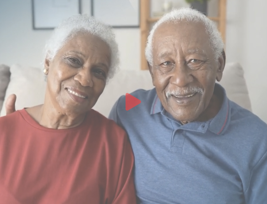 Woman and man smiling.